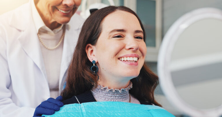 Teeth, smile and mirror with woman at dentist for dental care, treatment and fresh breath. Cleaning, tooth whitening and happy person for oral hygiene, orthodontics or wellness with veneer inspection